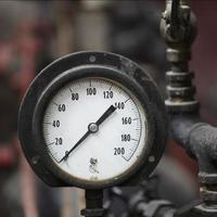 Closeup of Antique Steam Engine Pressure Gauge photo