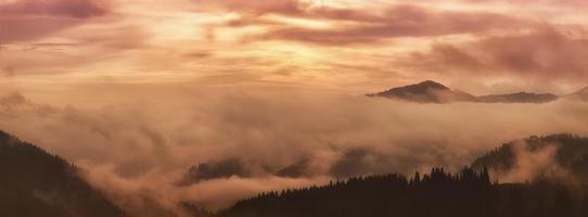 Mountain foggy sunrise photo