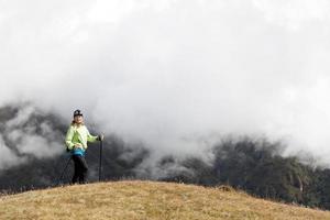 Woman hiking in Himalaya Mountains photo