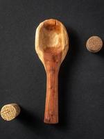 Brown wooden spoon with cork photo