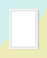 Blank white frame on pastel green and yellow