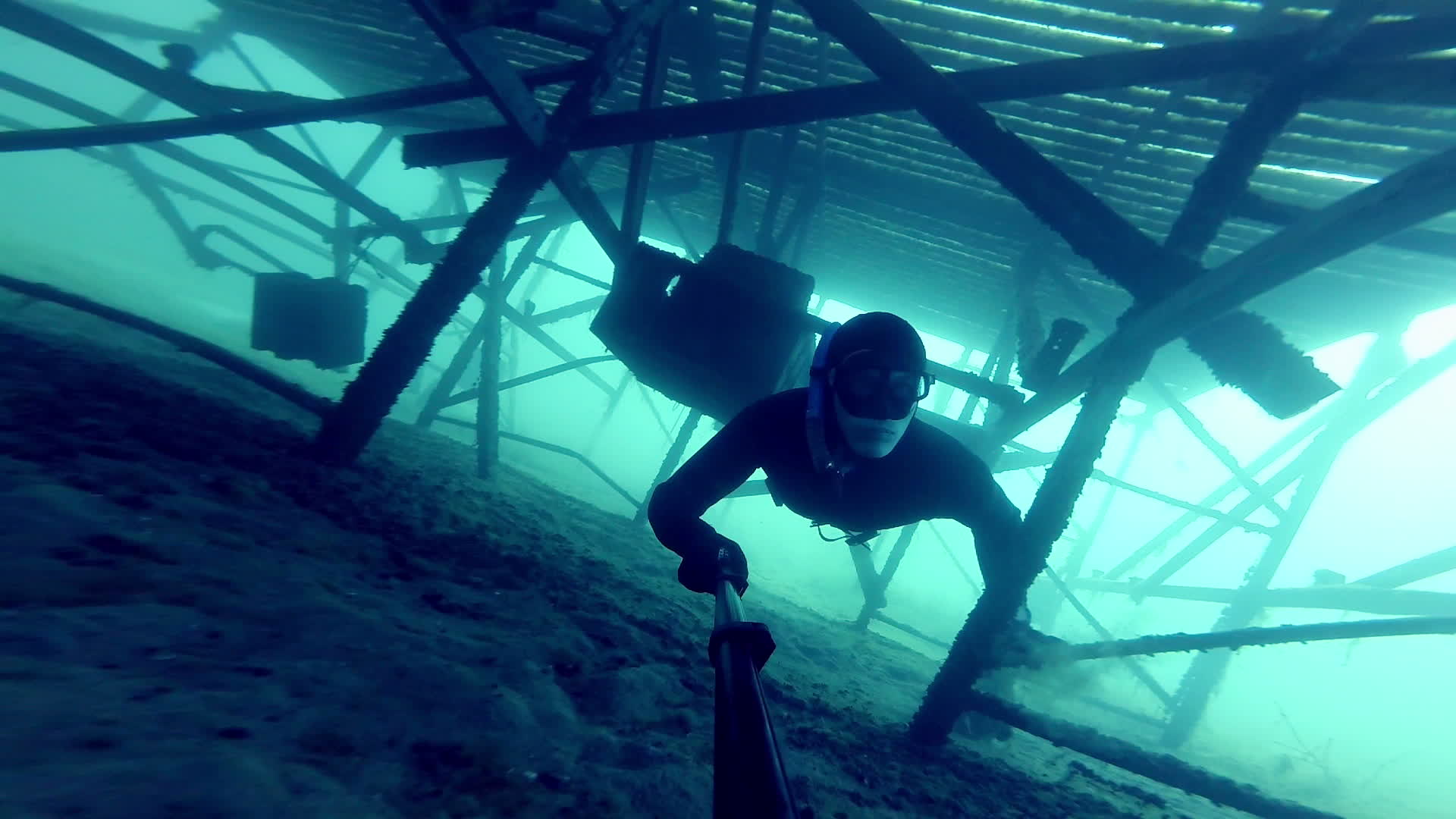Freediver Exploring a Big Underwater Structure 1331263 Stock Video at