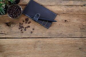 Notebook and coffee beans on a table photo