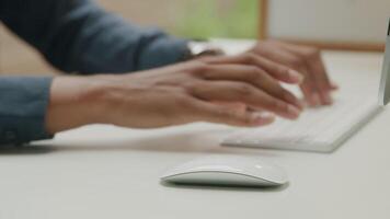 Young man using computer mouse and keyboard video