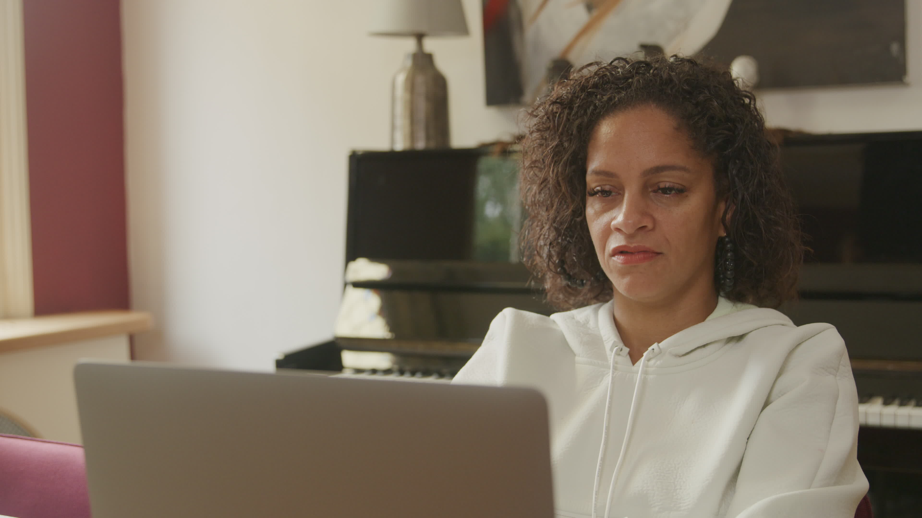 Mature woman using laptop at home