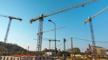 Time-lapse of construction site works with crane.