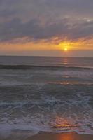 Ocean Tide At Sunset