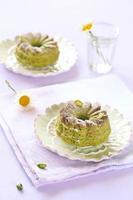Pistachio Cakes on white plates photo