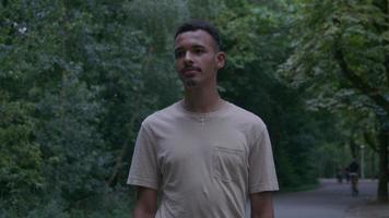 Young man standing in park video