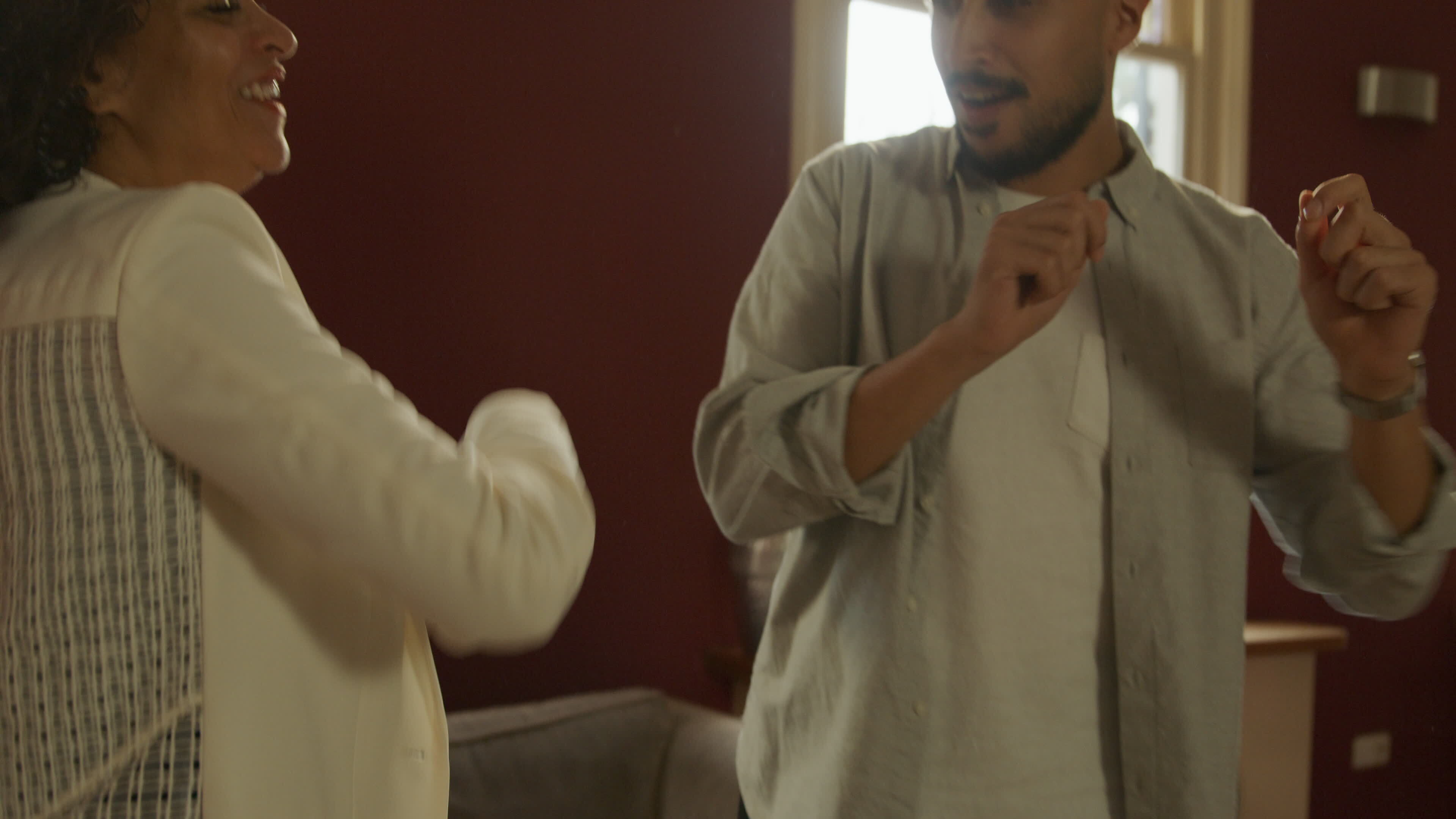 Mature woman dancing with young