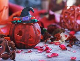 pumpkin on a background of dry plants and candles photo