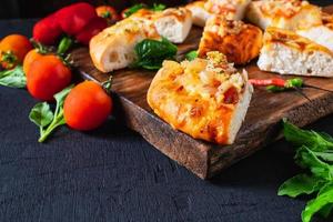 Hot pizza on wooden tray  photo