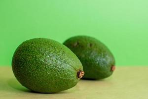 Two fresh avocados photo