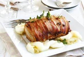 Bacon-Wrapped Pork Loin with Apples and Onion photo