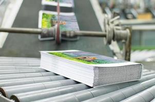 Book, magazine, catalog production line into press plant house.