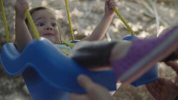 Slow motion of girl on swing video