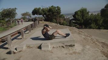 Slow motion of mid adult man doing crunches video