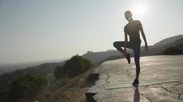 Slow motion of woman doing tree pose video