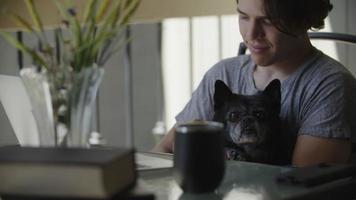 Slow motion of young man holding dog video
