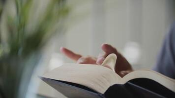 Slow motion of man reading book video