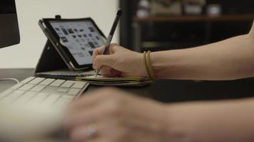 Slow motion of woman making notes