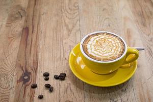 A Latte Coffee on wooden desk