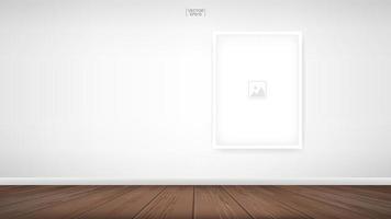 Vertical empty photo frame on white wall in room vector