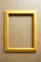 Wooden picture frame on wooden background. photo