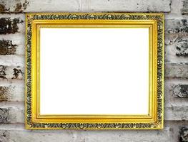 blank golden frame on brick stone wall photo