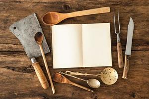 Cookbook and kitchen utensils photo