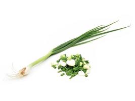 chopped spring onions on a white background