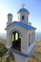 Miniature chapel along the roadside photo
