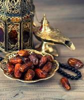 Traditional arabic lamp, latern, dates and rosary photo
