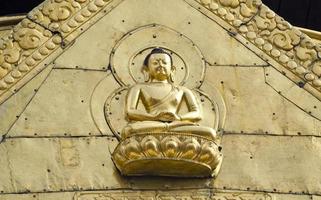 golden Buddha on asia temple wall, Kathmandu photo