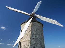Windmill in blue sky photo