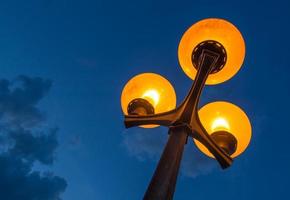 Scenic Streetlamp with Cloudy Night Sky photo