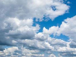 Wool-pack clouds in blue sky photo