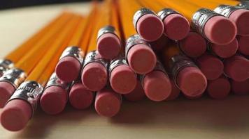 Pile of same pencils with erasers, dolly video