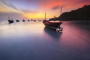 Fishing boats seaside  beach during sunset