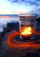 Candle in twilight photo