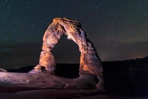 Delicate Arch at Night against Beautiful night sky photo