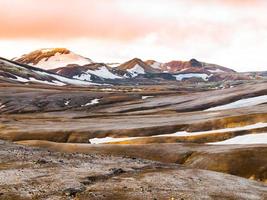 Rainbow mountains with fields of snow photo