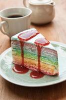Rainbow crape cake on plate. (Selective Focus) photo