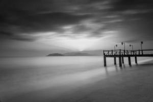 Long exposure of magic sunrise and wooden pier