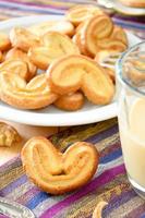 Palmeras - sweet puff pastry. Heart shaped cookies with sugar photo