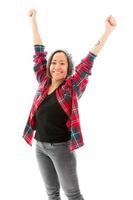 Young woman celebrating with her arms raised