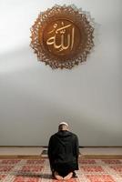 Muslim Man Praying At Mosque photo