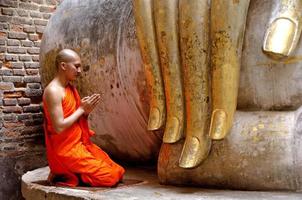 Buddhist monk praying