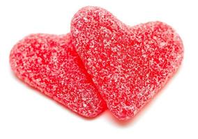 two heart-shaped candies isolated on white background photo