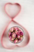 rose tea buds in glass